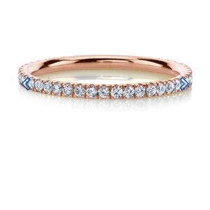 14k Rose gold white diamond eternity band. Diamonds go around the entire band.